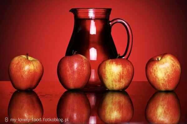 Apples and pitcher with juice